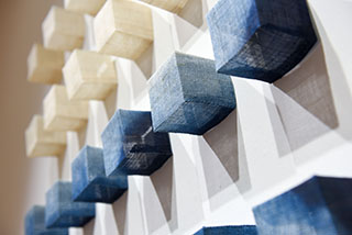 Detail shot of fabric boxes in grid pattern